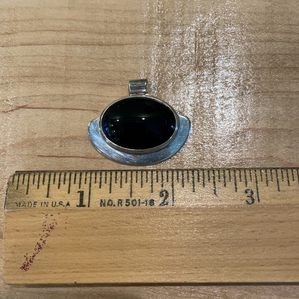 Sterling silver and black onyx pendant 1 1/4” wide